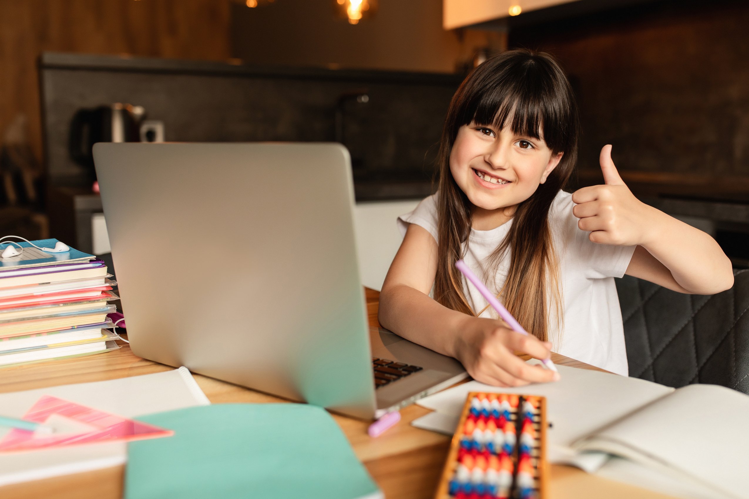 Online learning. Happy girl studying at home. Education and distance learning.